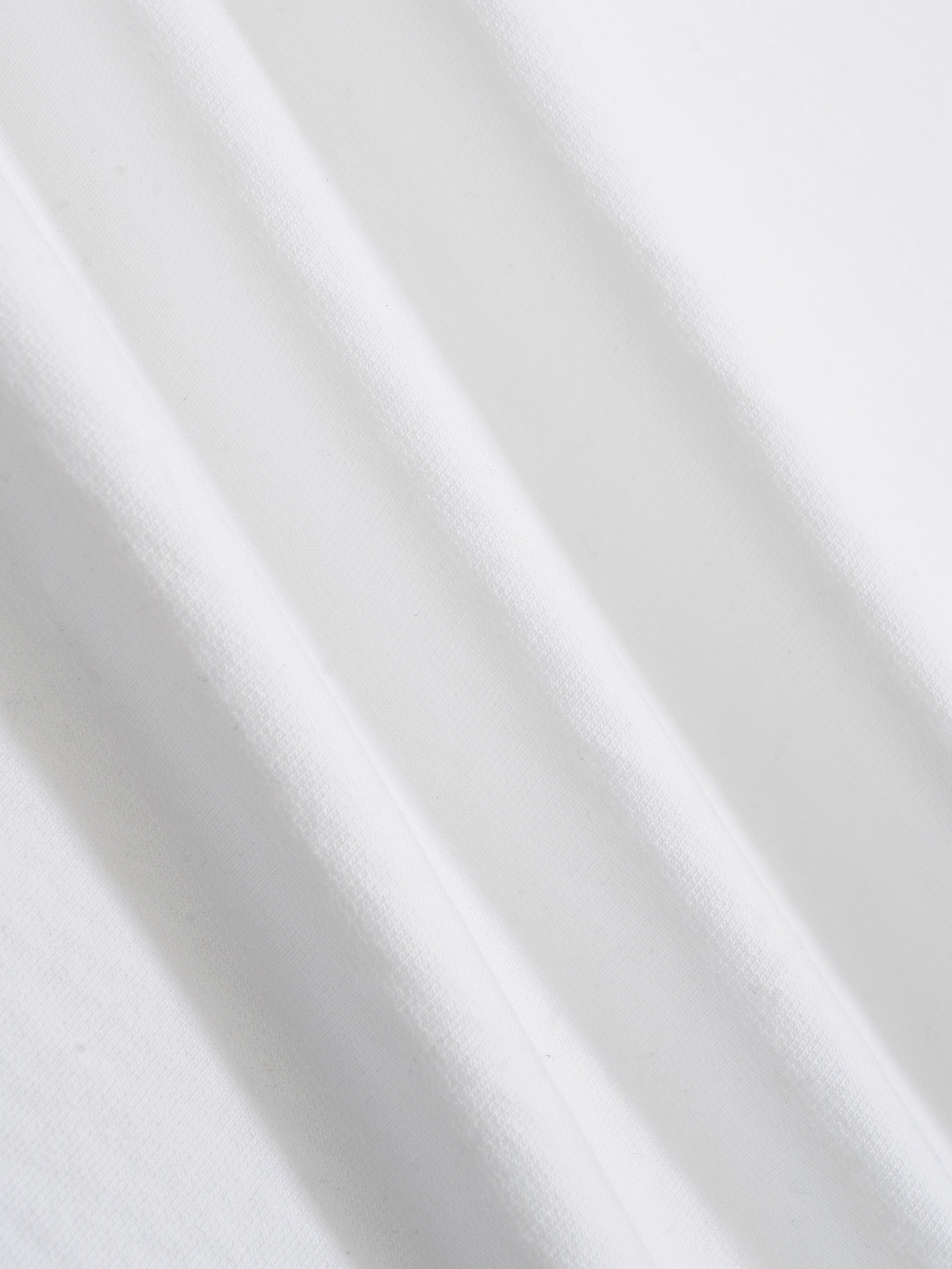 white cotton t-shirt fabric close up showing texture