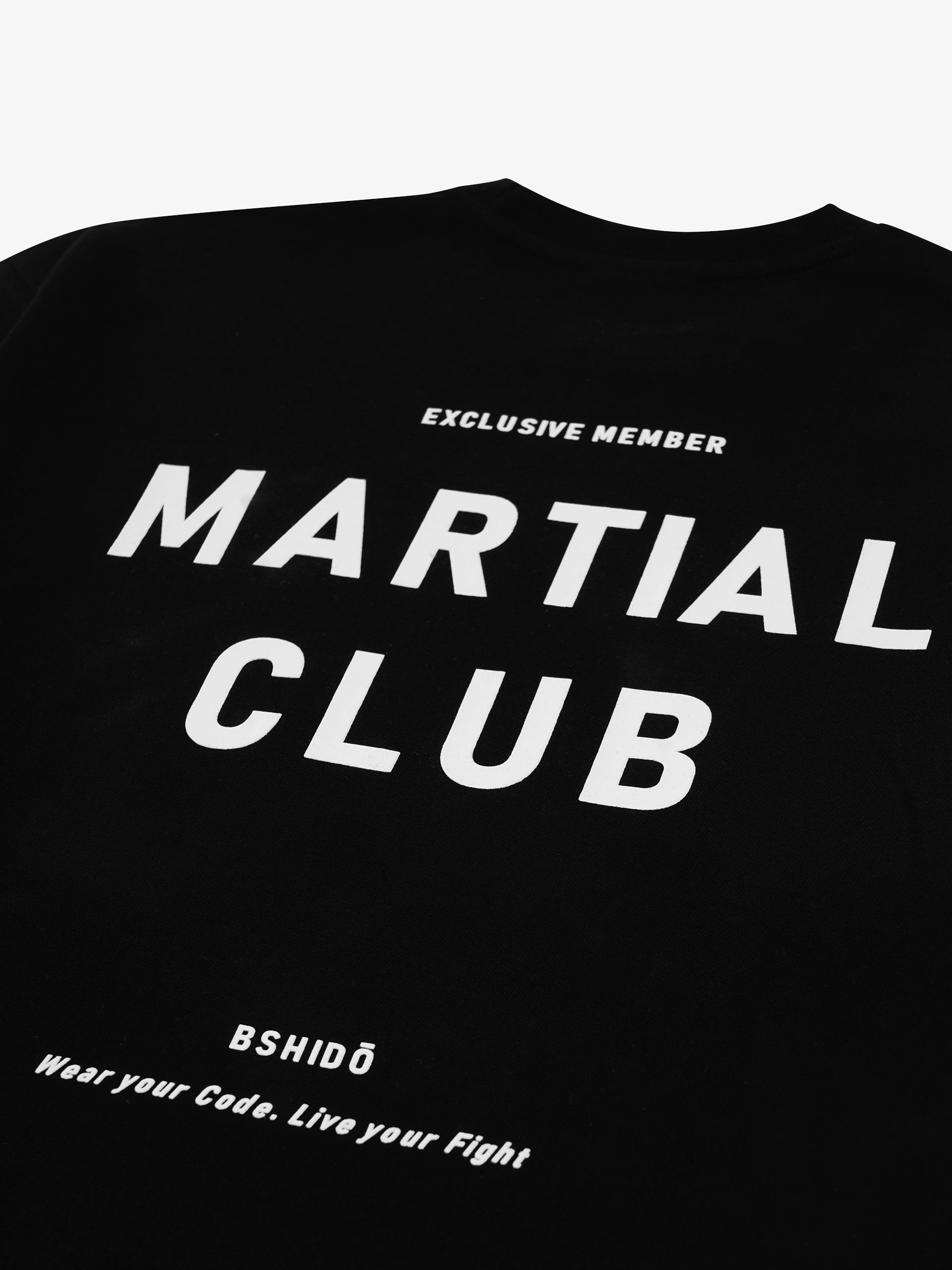 black t-shirt back print close up showing martial club graphic