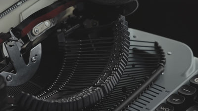 Cinematic video showing the words "Prologue by Bshido" being typed on paper using a vintage mechanical typewriter